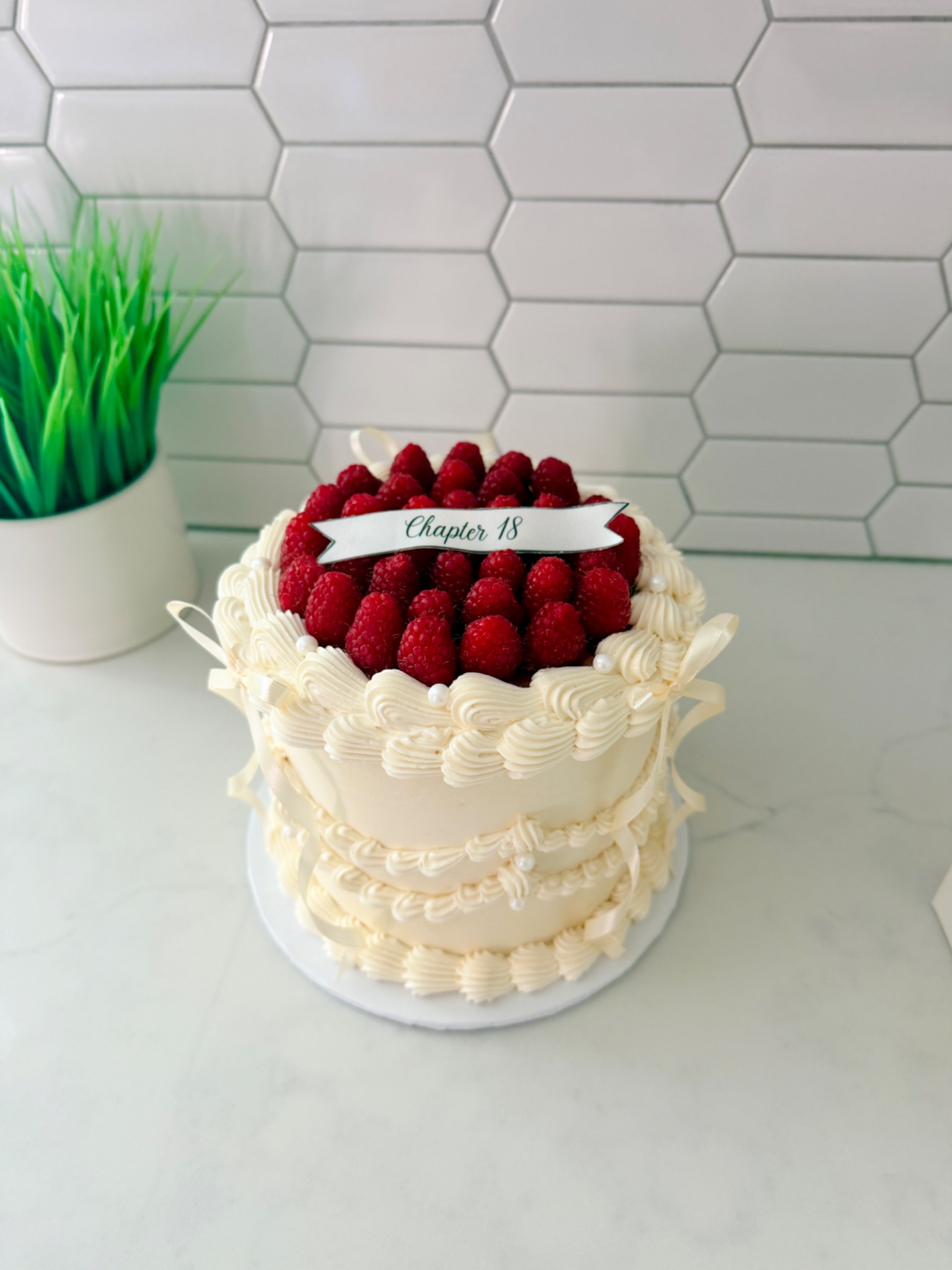 Raspberry topped celebration cake